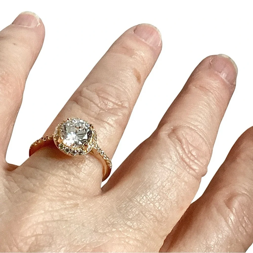 Round Clear Stone Set in Gold Tone Band Mini Side Stone Detailing Size 8.75
